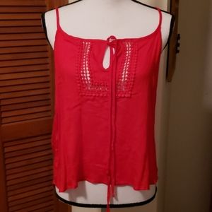 Red, strappy summer top.